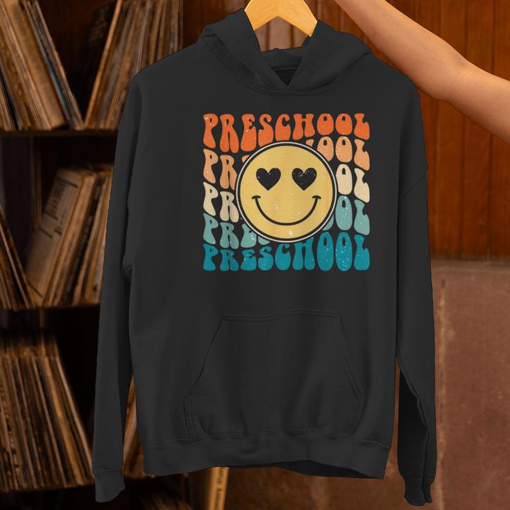 Back To School Groovy Smile Preschool Teachers Students Kids Women's Hoodie, gift for family, gift for coworker Back To School Groovy Smile Preschool Teachers Students Kids Women's Hoodie, gift for family, gift for coworker