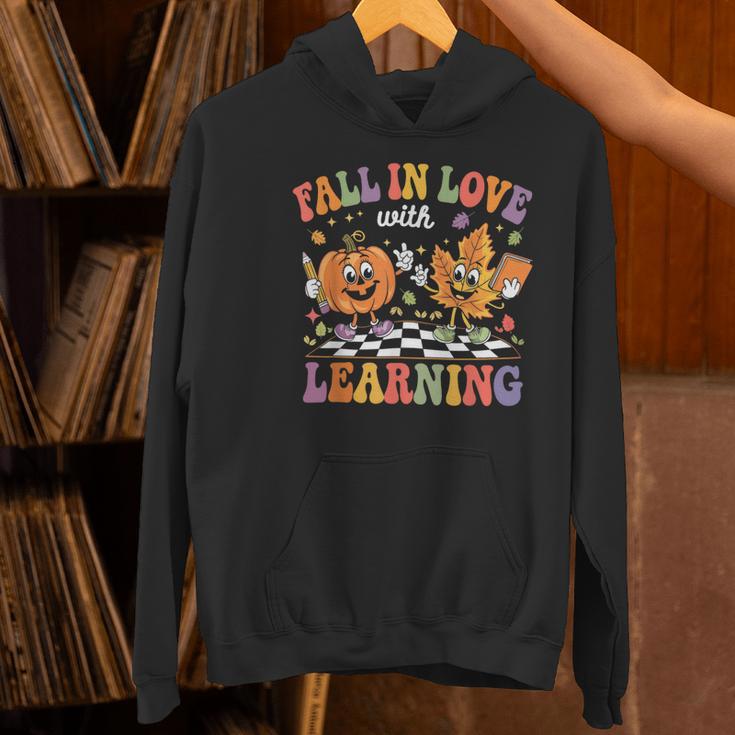 Fall In Love With Learning Autumn Fall Season Teacher Women's Hoodie, gift for family, gift for coworker