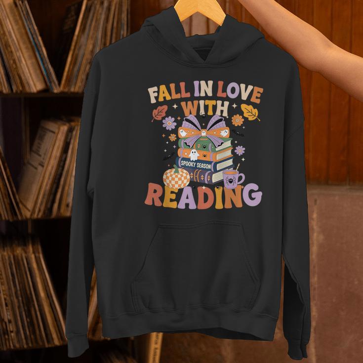 Fall In Love With Reading Halloween Stack Of Book Teacher Women's Hoodie, gift for family, gift for coworker Fall In Love With Reading Halloween Stack Of Book Teacher Women's Hoodie, gift for family, gift for coworker