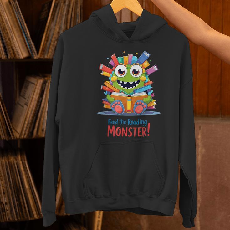 Feed The Reading Monster Halloween Teacher Women's Hoodie, gift for family, gift for coworker