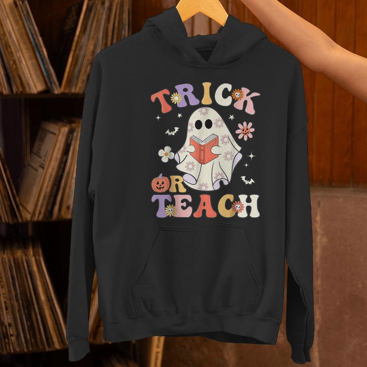 Groovy Halloween Trick Or Teach Retro Floral Ghost Teacher Women's Hoodie, Groovy Teacher Hoodies, gift for family, gift for coworker Groovy Halloween Trick Or Teach Retro Floral Ghost Teacher Women's Hoodie, Groovy Teacher Hoodies, gift for family, gift for coworker