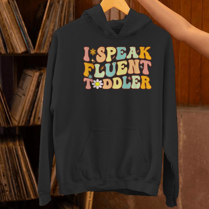 Groovy I Speak Fluent Toddler Daycare Provider Teacher Women's Hoodie, Groovy Teacher Hoodies, gift for family, gift for coworker Groovy I Speak Fluent Toddler Daycare Provider Teacher Women's Hoodie, Groovy Teacher Hoodies, gift for family, gift for coworker