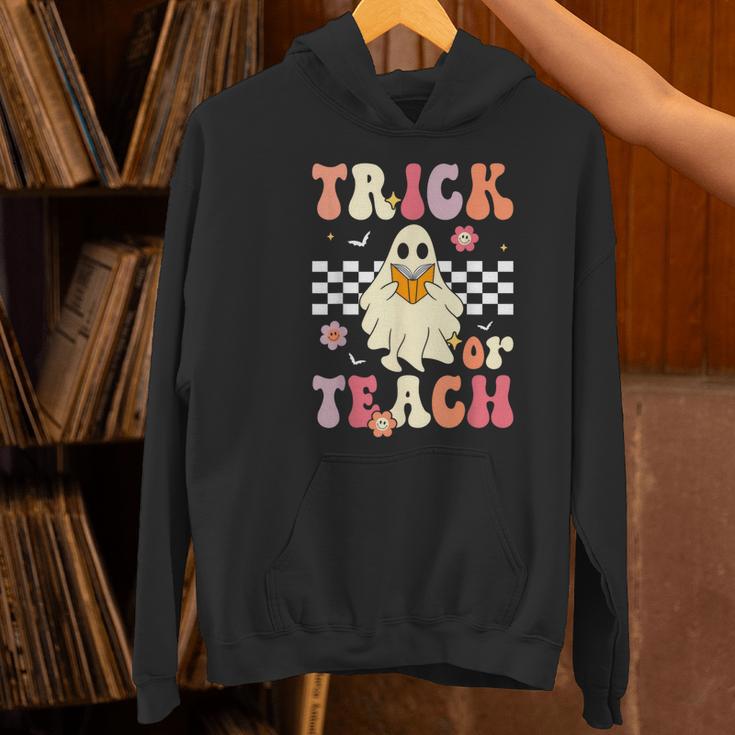 Groovy Teacher Halloween Retro Trick Or Teach Floral Ghost Women's Hoodie, Groovy Teacher Hoodies, gift for family, gift for coworker Groovy Teacher Halloween Retro Trick Or Teach Floral Ghost Women's Hoodie, Groovy Teacher Hoodies, gift for family, gift for coworker