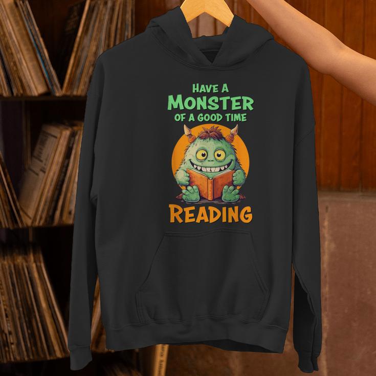 Halloween Teacher Librarian Monster Reading Books Men Women Kids Women's Hoodie, gift for family, gift for coworker