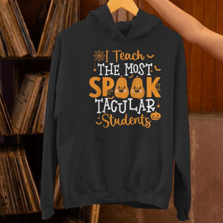 Halloween Teacher I Teach The Most Spooktacular Students Men Women Women's Hoodie, gift for family, gift for coworker