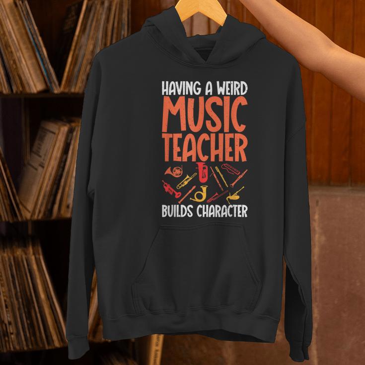 Having a Weird Music Teacher Builds Character Music Teacher Women's Hoodie, gift for family, gift for coworker