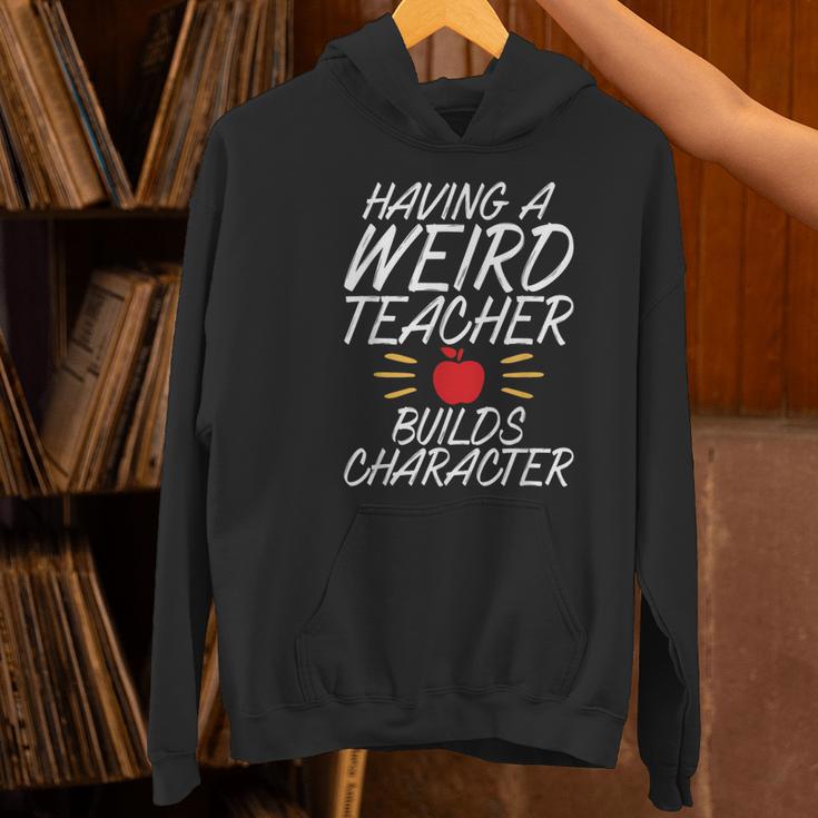 Having a Weird Teacher Builds Character School Teacher Women's Hoodie, gift for family, gift for coworker Having a Weird Teacher Builds Character School Teacher Women's Hoodie, gift for family, gift for coworker