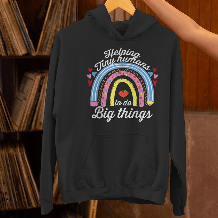 Helping Tiny Humans To Do Big Things Teacher Women Women's Hoodie, gift for family, gift for coworker