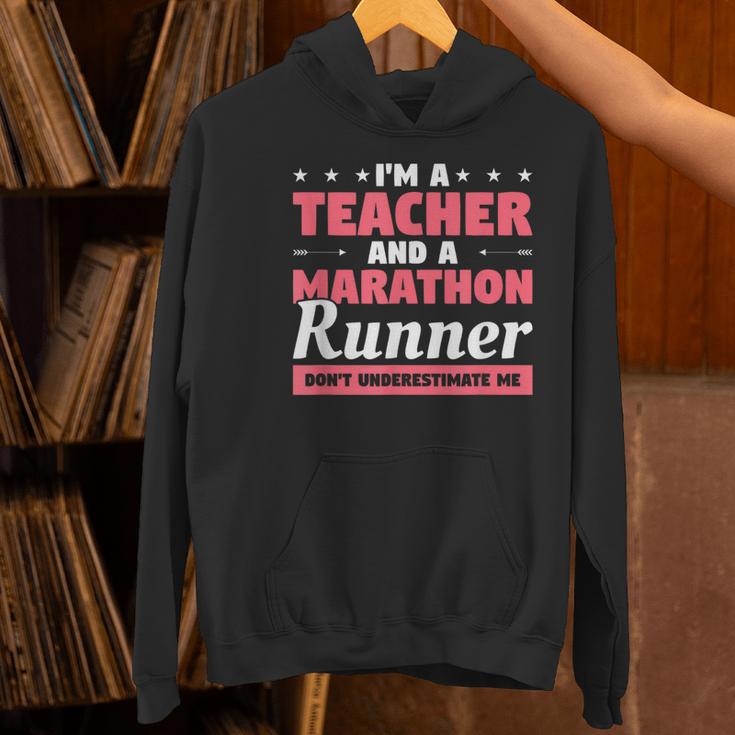 I'm A Teacher And A Marathon Runner Don't Underestimate Me Men Women Women's Hoodie, gift for family, gift for coworker