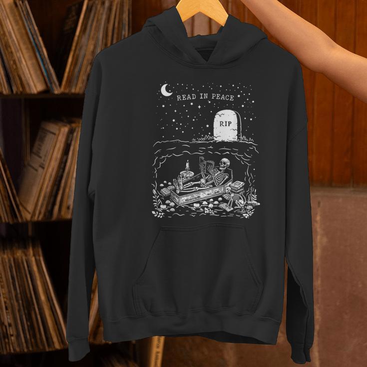 Read In Peace Skeleton Halloween Book Reading Spooky Teacher Women's Hoodie, gift for family, gift for coworker