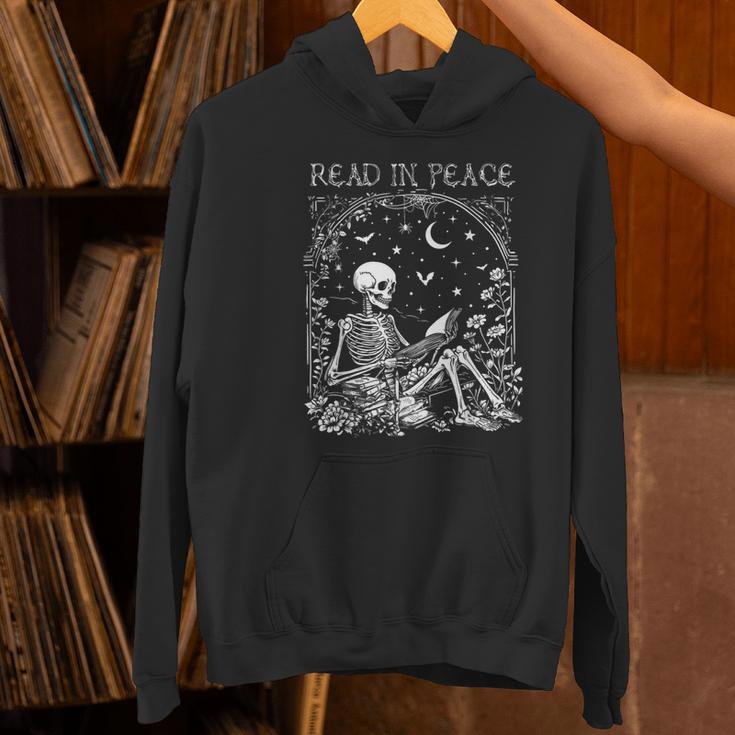 Read In Peace Skeleton Reading Teacher Spooky Halloween Women's Hoodie, gift for family, gift for coworker Read In Peace Skeleton Reading Teacher Spooky Halloween Women's Hoodie, gift for family, gift for coworker