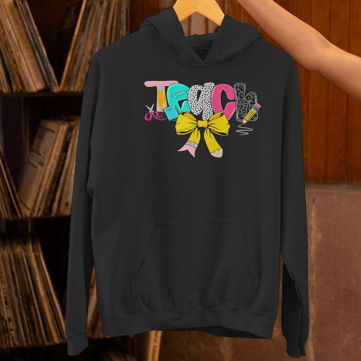 Teach Coquette Bow Teacher Back To School Happy First Day Women's Hoodie, gift for family, gift for coworker Teach Coquette Bow Teacher Back To School Happy First Day Women's Hoodie, gift for family, gift for coworker