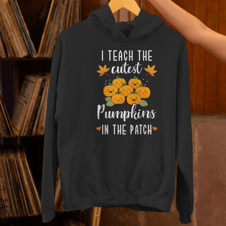 I Teach The Cutest Pumpkins In The Patch Halloween Teacher Women's Hoodie, gift for family, gift for coworker