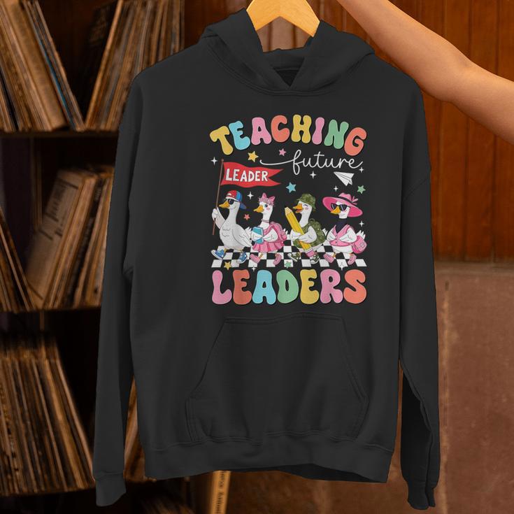Teaching Future Leaders Groovy Teacher Back To School Women's Hoodie, Future Teacher Hoodies, Groovy Teacher Hoodies, gift for family, gift for coworker