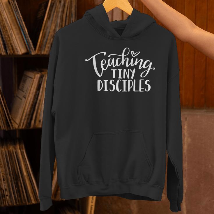 Teaching Tiny Disciples Christian Teacher Women's Hoodie, gift for family, gift for coworker Teaching Tiny Disciples Christian Teacher Women's Hoodie, gift for family, gift for coworker