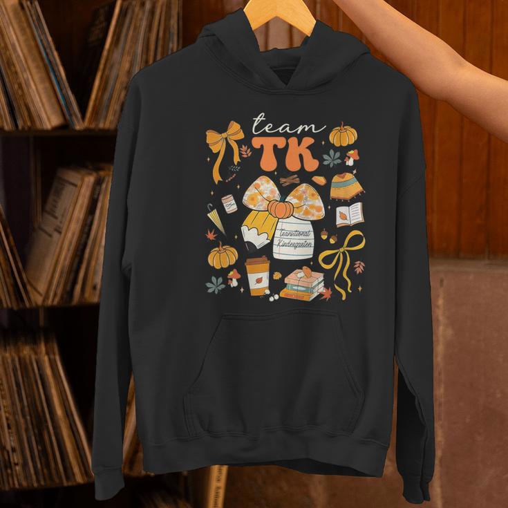 Team TK Crew Preppy Coquette Bow Pumpkin Fall TK Teacher Women's Hoodie, gift for family, gift for coworker