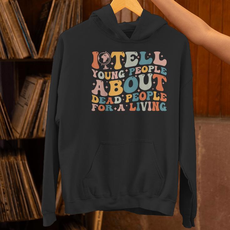 I Tell Young People About Dead People Groovy History Teacher Women's Hoodie, History Teacher Hoodies, Groovy Teacher Hoodies, gift for family, gift for coworker I Tell Young People About Dead People Groovy History Teacher Women's Hoodie, History Teacher Hoodies, Groovy Teacher Hoodies, gift for family, gift for coworker