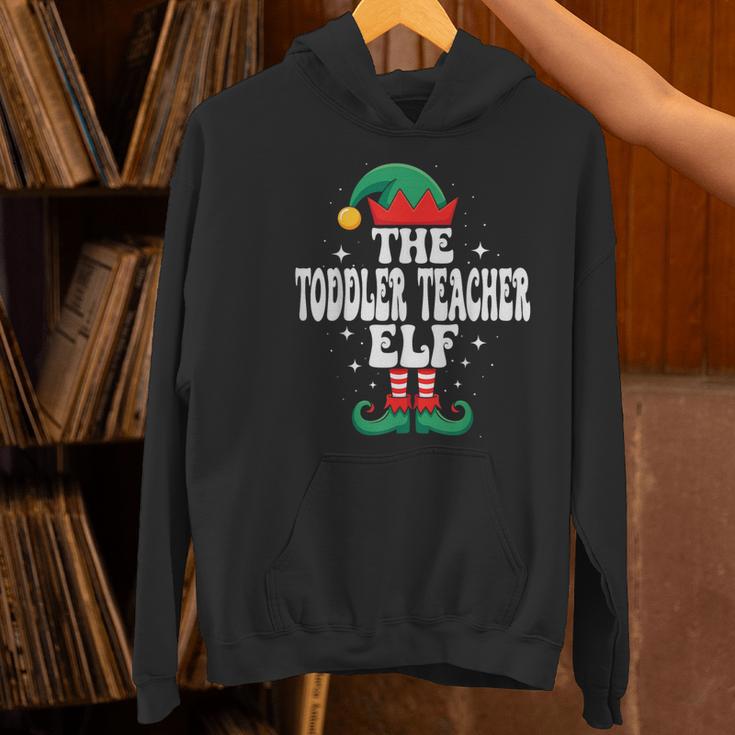 The Toddler Teacher Elf Christmas Matching Family Women's Hoodie, gift for family, gift for coworker The Toddler Teacher Elf Christmas Matching Family Women's Hoodie, gift for family, gift for coworker