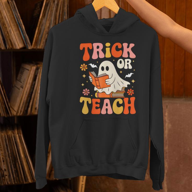 Trick Or Teach Halloween Shirt For Teacher Kids Floral Ghost Women's Hoodie, gift for family, gift for coworker Trick Or Teach Halloween Shirt For Teacher Kids Floral Ghost Women's Hoodie, gift for family, gift for coworker