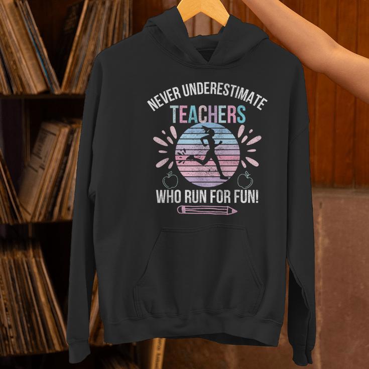 Never Underestimate Teachers Who Runs For Fun Running Teache Women's Hoodie, gift for family, gift for coworker Never Underestimate Teachers Who Runs For Fun Running Teache Women's Hoodie, gift for family, gift for coworker