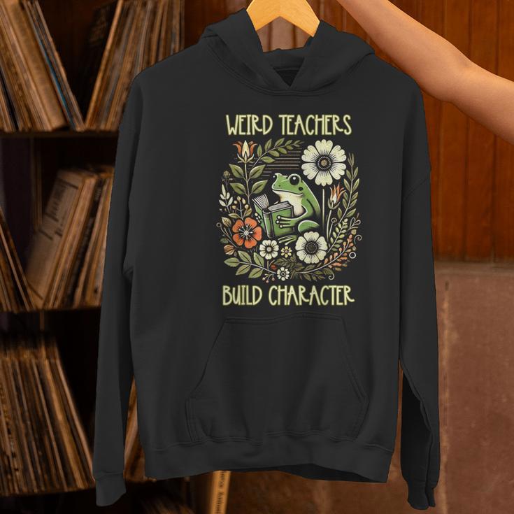 Weird Teachers Build Character Frog Reading Book Librarian Women's Hoodie, gift for family, gift for coworker Weird Teachers Build Character Frog Reading Book Librarian Women's Hoodie, gift for family, gift for coworker