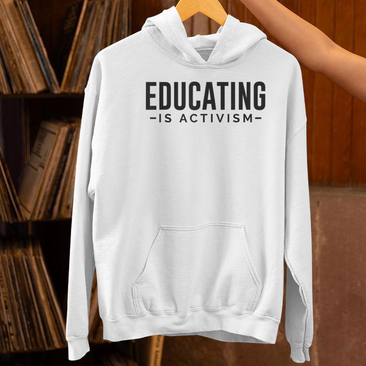 Educating Is Activism Feminist Social Justice Teacher For Men Women Women's Hoodie, gift for family, gift for coworker
