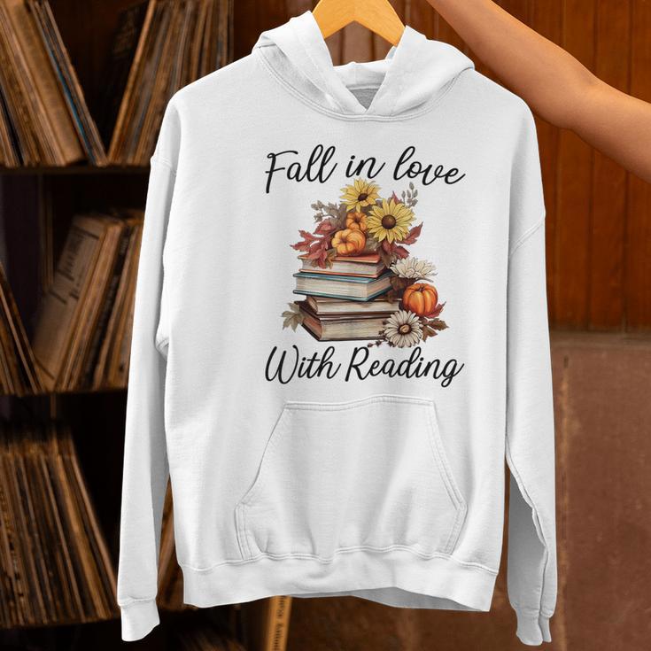 Fall In Love With Reading Book Autumn Teachers Pumpkins Women's Hoodie, gift for family, gift for coworker