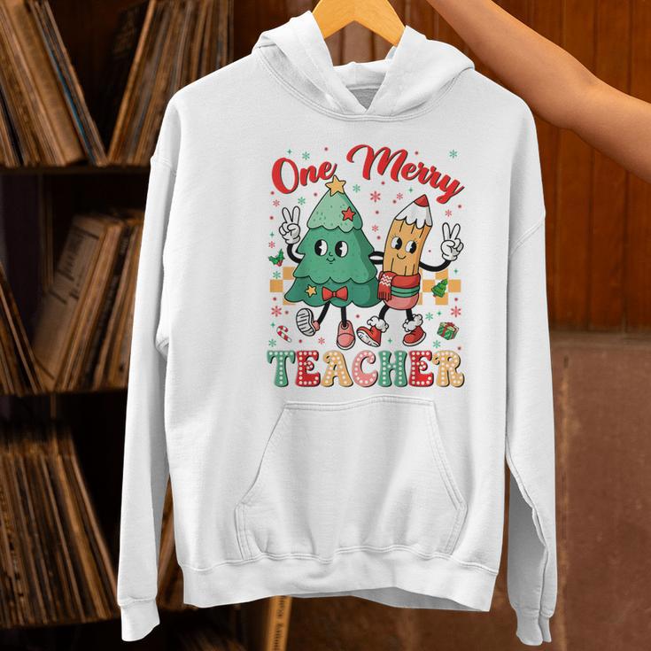 One Merry Teacher Groovy Christmas Tree Pjs Xmas Teacher Women's Hoodie, Groovy Teacher Hoodies, gift for family, gift for coworker