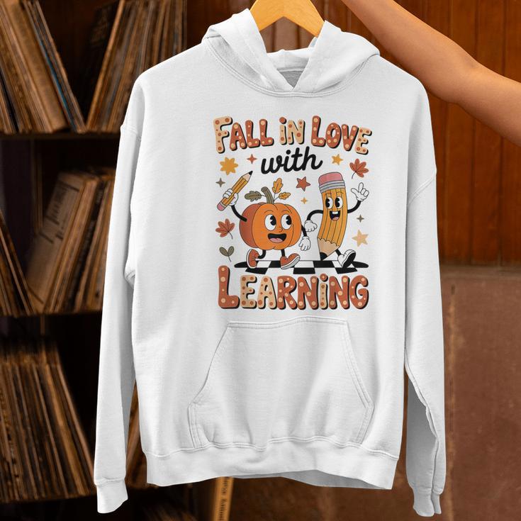 Retro Fall In Love With Learning Autumn Pumpkin Teacher Kids Women's Hoodie, gift for family, gift for coworker