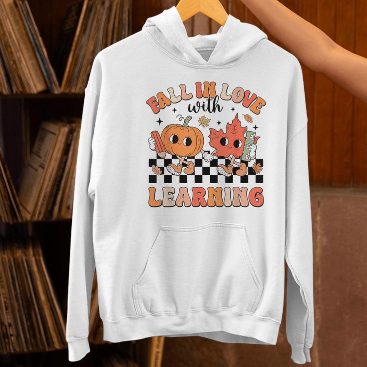 Retro Fall In Love With Learning Autumn Pumpkin Teacher Women's Hoodie, gift for family, gift for coworker