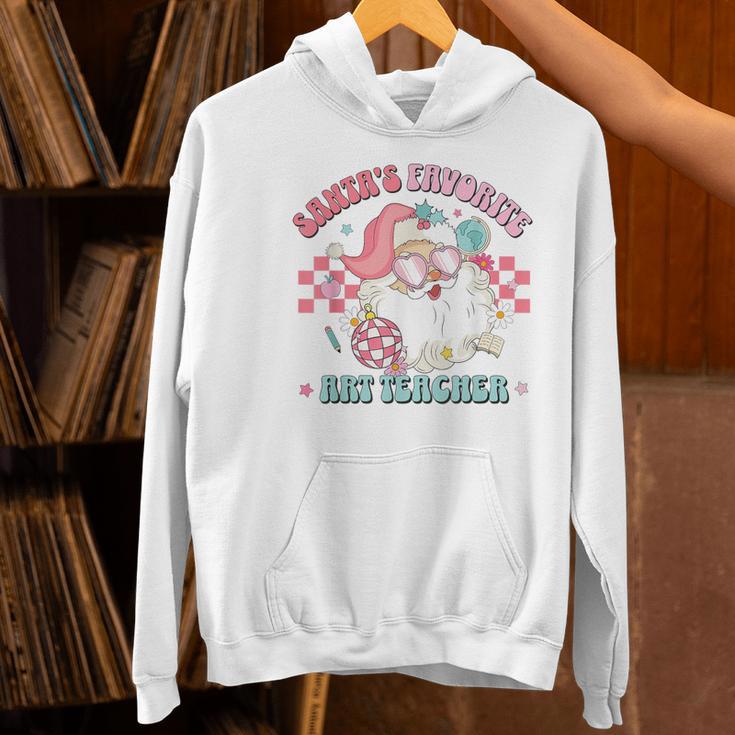 Retro Pink Christmas Santa's Favorite Art Teacher Artist Women's Hoodie, gift for family, gift for coworker