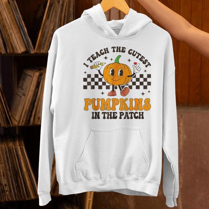 I Teach The Cutest Pumpkins In The Patch Groovy Teacher Fall Women's Hoodie, Groovy Teacher Hoodies, gift for family, gift for coworker
