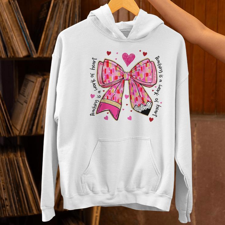 Teaching Is A Work Of Heart Pencil Bow Teacher Valentine Women's Hoodie, gift for family, gift for coworker Teaching Is A Work Of Heart Pencil Bow Teacher Valentine Women's Hoodie, gift for family, gift for coworker