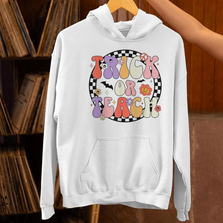 Trick Or Teach Retro Groovy Halloween Teacher Women's Hoodie, Groovy Teacher Hoodies, gift for family, gift for coworker Trick Or Teach Retro Groovy Halloween Teacher Women's Hoodie, Groovy Teacher Hoodies, gift for family, gift for coworker