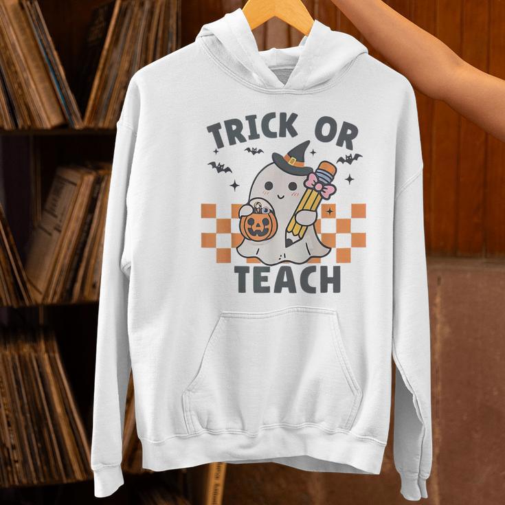 Trick Or Teach Teacher Women's Hoodie, gift for family, gift for coworker Trick Or Teach Teacher Women's Hoodie, gift for family, gift for coworker