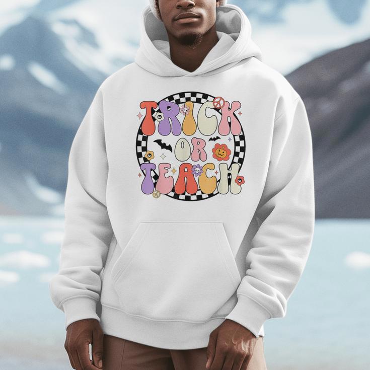 Trick Or Teach Retro Groovy Halloween Teacher Men Hoodie, Groovy Teacher Gifts, funny design