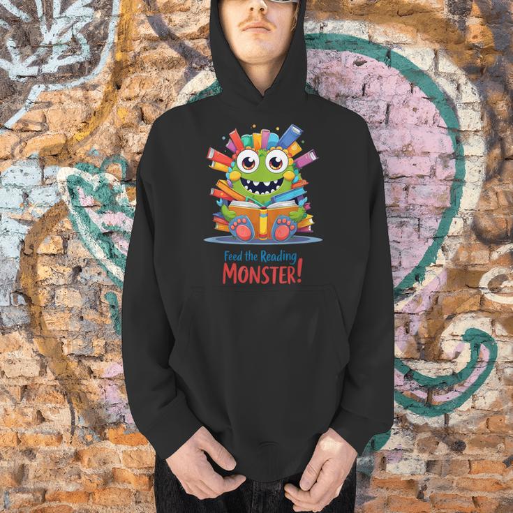 Feed The Reading Monster Halloween Teacher Men Hoodie, gift for family, gift for coworker Feed The Reading Monster Halloween Teacher Men Hoodie, gift for family, gift for coworker