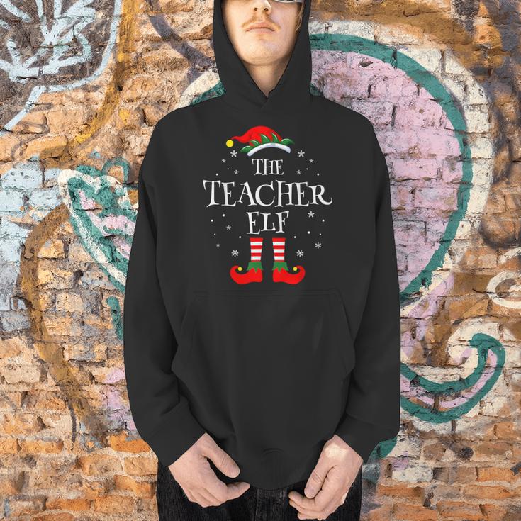 The Teacher Elf Christmas Family Matching Group Xmas Men Hoodie, gift for family, gift for coworker The Teacher Elf Christmas Family Matching Group Xmas Men Hoodie, gift for family, gift for coworker