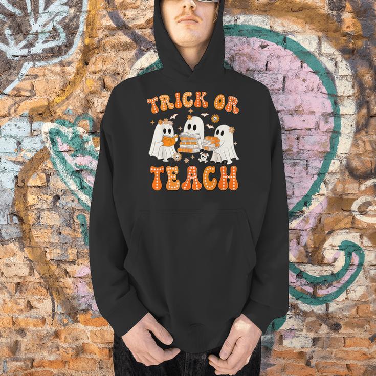 Teacher Halloween Trick Or Teach Retro Groovy Floral Ghost Men Hoodie, Groovy Teacher Hoodies, gift for family, gift for coworker Teacher Halloween Trick Or Teach Retro Groovy Floral Ghost Men Hoodie, Groovy Teacher Hoodies, gift for family, gift for coworker