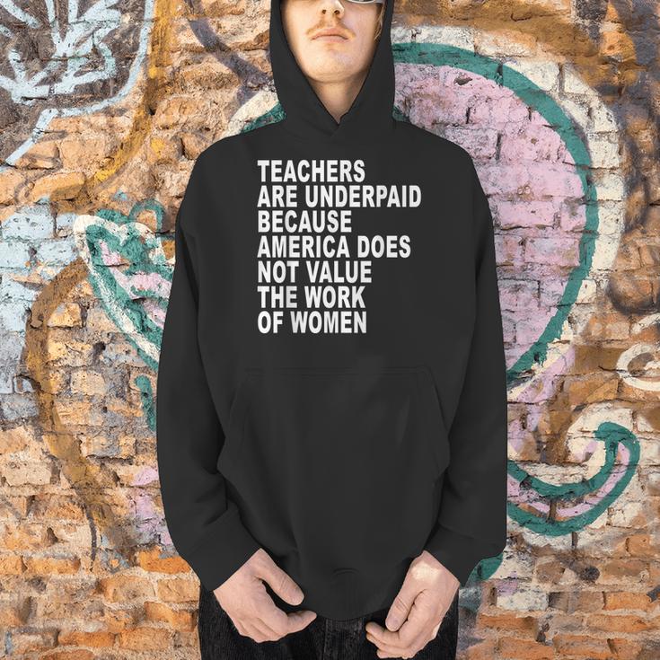 Teachers Are Underpaid Because America Does Not Value Men Women Men Hoodie, gift for family, gift for coworker Teachers Are Underpaid Because America Does Not Value Men Women Men Hoodie, gift for family, gift for coworker