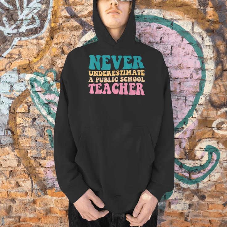 Never Underestimate A Public School Teacher Groovy Women Men Hoodie, Groovy Teacher Hoodies, gift for family, gift for coworker Never Underestimate A Public School Teacher Groovy Women Men Hoodie, Groovy Teacher Hoodies, gift for family, gift for coworker