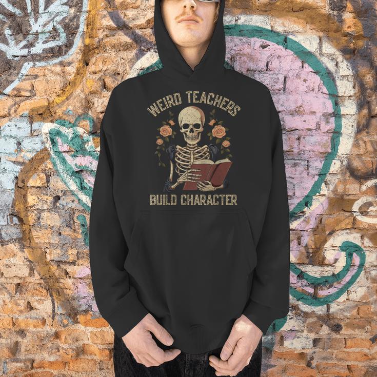 Weird Teachers Build Character Skeleton Book Halloween Women Men Hoodie, gift for family, gift for coworker Weird Teachers Build Character Skeleton Book Halloween Women Men Hoodie, gift for family, gift for coworker