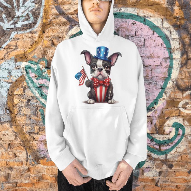 Boston Terrier Puppy Dog Holds His American Flag 4th Of July Men Hoodie, American Boston Terrier Hoodies, Boston Terrier 4th Of July Hoodies, gift for family, gift for coworker