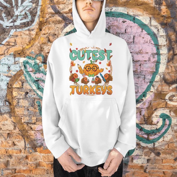 Humor I Teach The Cutest Turkeys Thanksgiving Teacher Men Hoodie, gift for family, gift for coworker