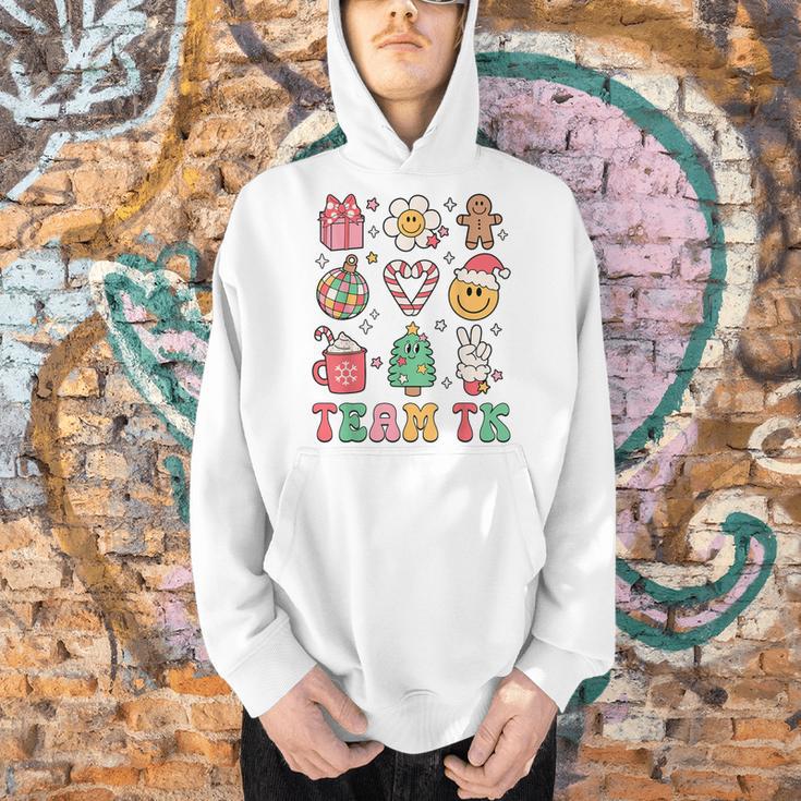 Team TK Teacher Christmas Groovy Smile Face Girl Boy Kid TK Men Hoodie, Groovy Teacher Hoodies, gift for family, gift for coworker Team TK Teacher Christmas Groovy Smile Face Girl Boy Kid TK Men Hoodie, Groovy Teacher Hoodies, gift for family, gift for coworker