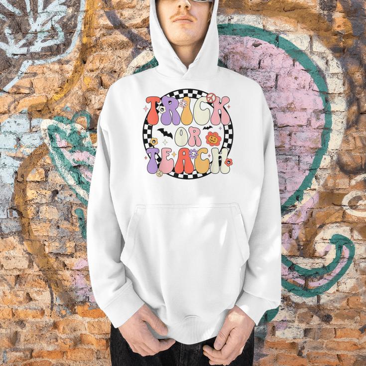 Trick Or Teach Retro Groovy Halloween Teacher Men Hoodie, Groovy Teacher Hoodies, gift for family, gift for coworker