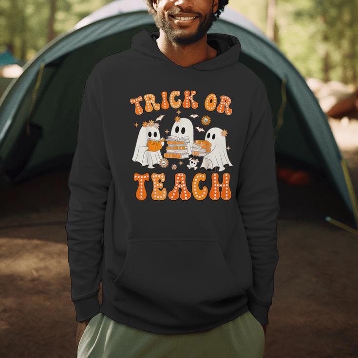 Teacher Halloween Trick Or Teach Retro Groovy Floral Ghost Men Hoodie, novelty gifts, funny gifts Teacher Halloween Trick Or Teach Retro Groovy Floral Ghost Men Hoodie, novelty gifts, funny gifts