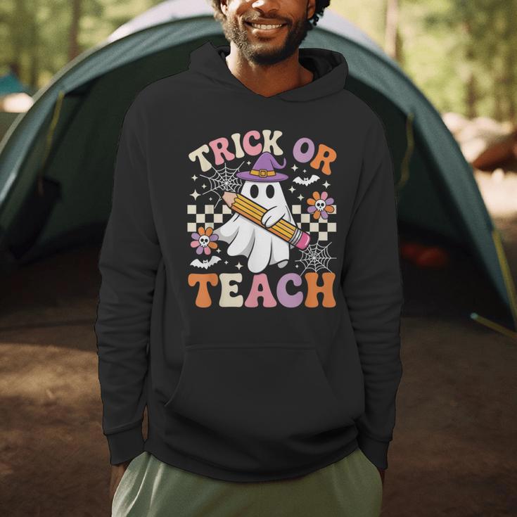 Trick Or Teach Groovy Teacher Halloween Retro Ghost Men Hoodie, novelty gifts, funny gifts