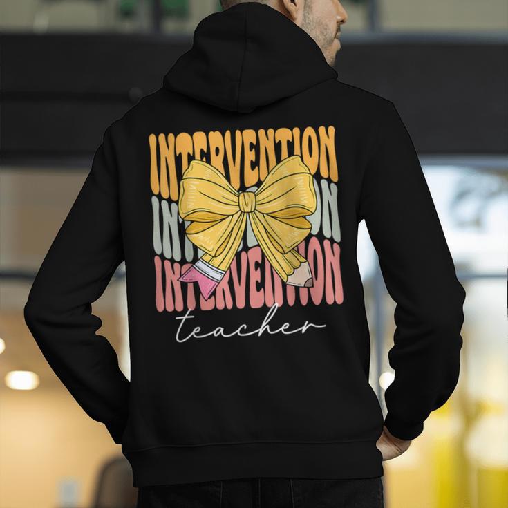 Interventionist Teacher Groovy Coquette Bow Back To School Men's Hoodie Back Print, Groovy Teacher Hoodies, funny gift