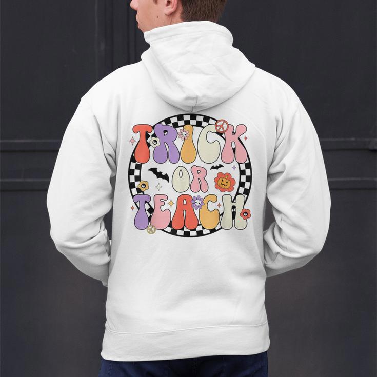 Trick Or Teach Retro Groovy Halloween Teacher Men's Hoodie Back Print, Groovy Teacher Hoodies, gift for family, gift for coworker